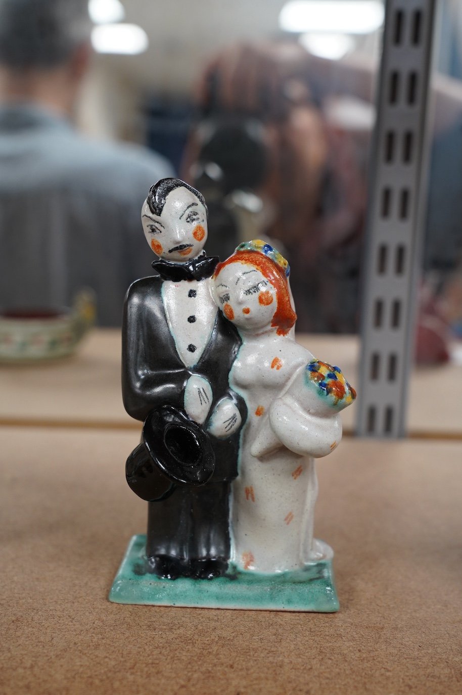 A Goldscheider stylised bride and groom, impressed 6239, 64 65, monogram H? 15.5cm high. Condition - good